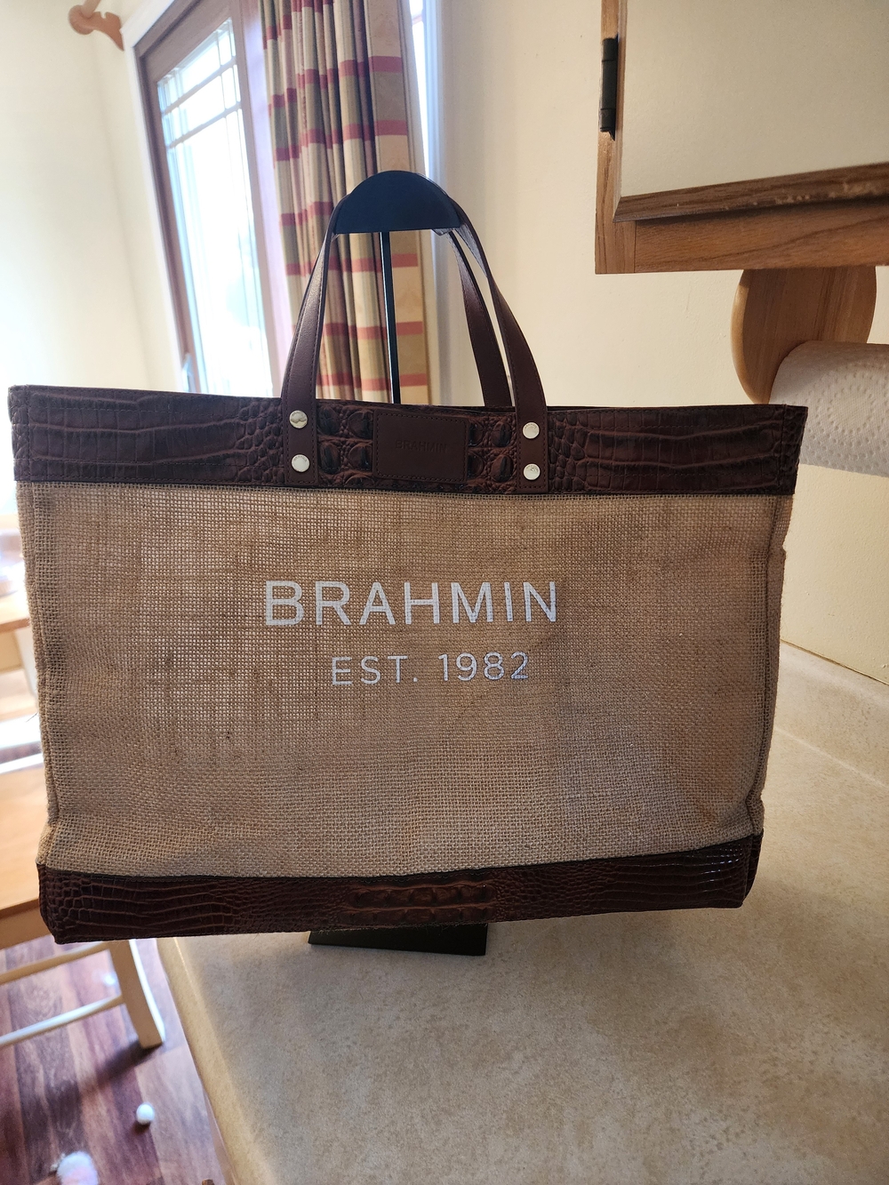 Brahmin Meredith tote bag featuring burlap construction  croc-embossed leather